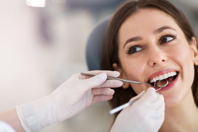 Woman,Having,Teeth,Examined,At,Dentists
